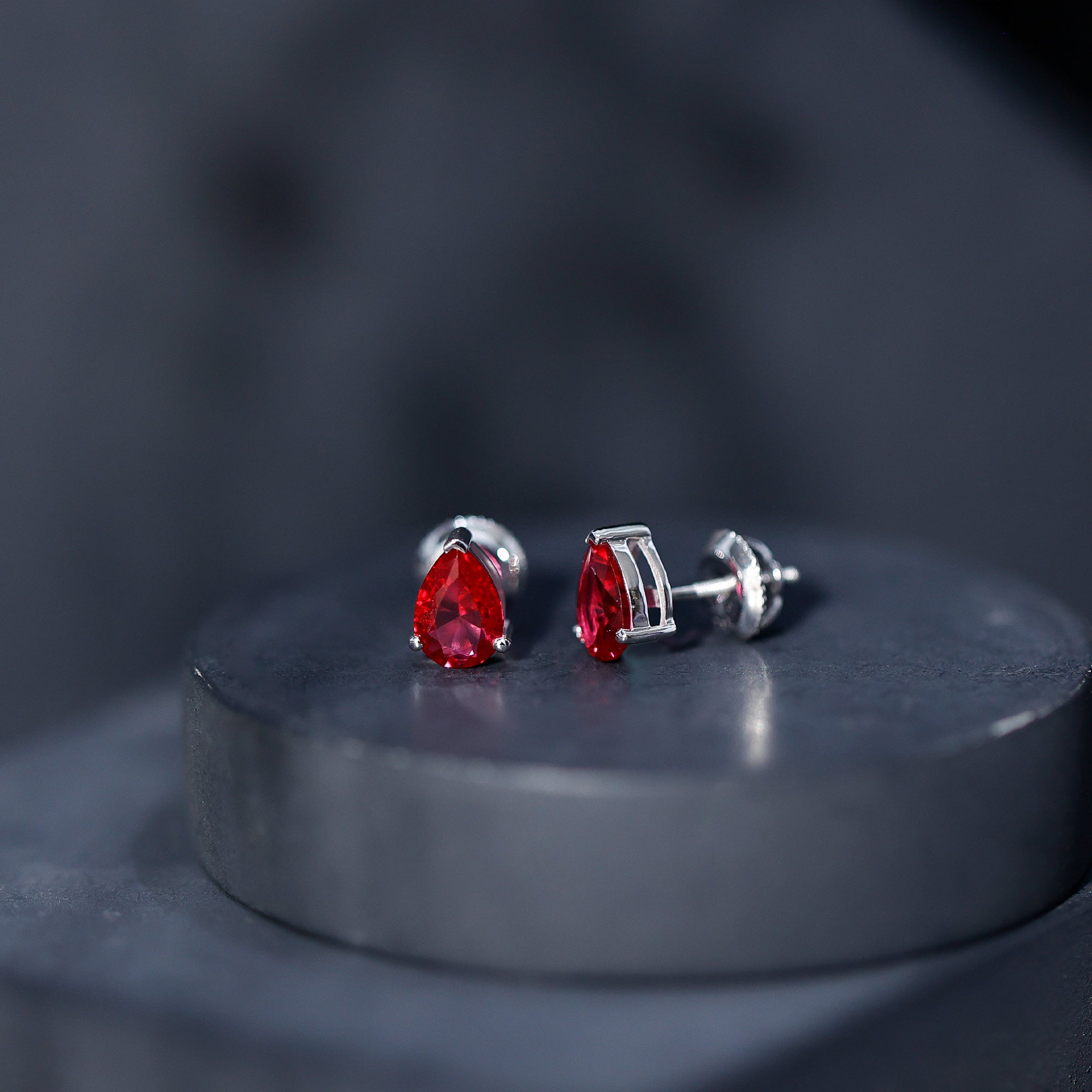 Solitaire 1.5 Carat Pear Shaped Lab Created Ruby Stud Earrings AAAA - Rosec Jewels