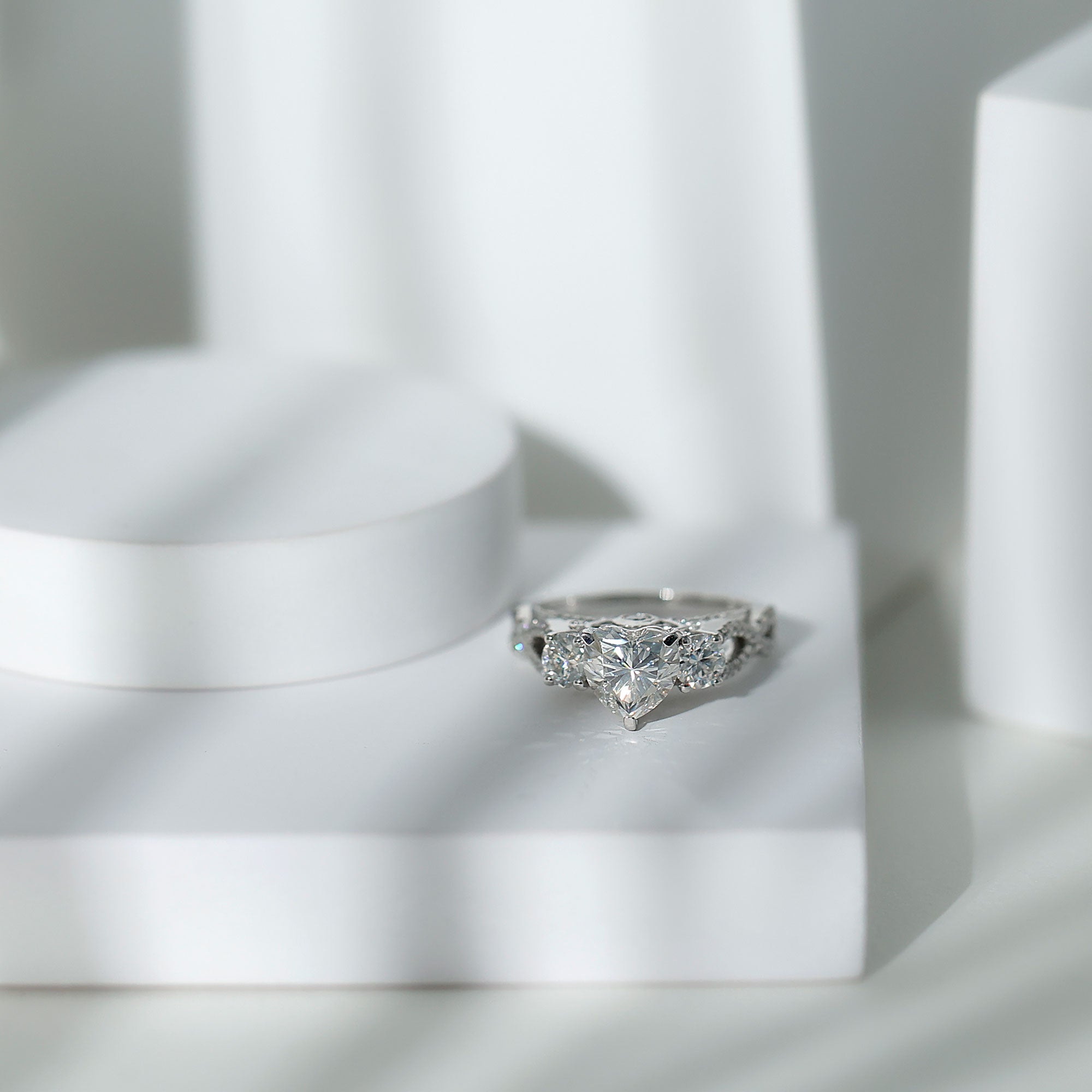 Rosec Jewels-1.5 Carat Heart Moissanite 3 Stone Engagement Ring in Crossover Band