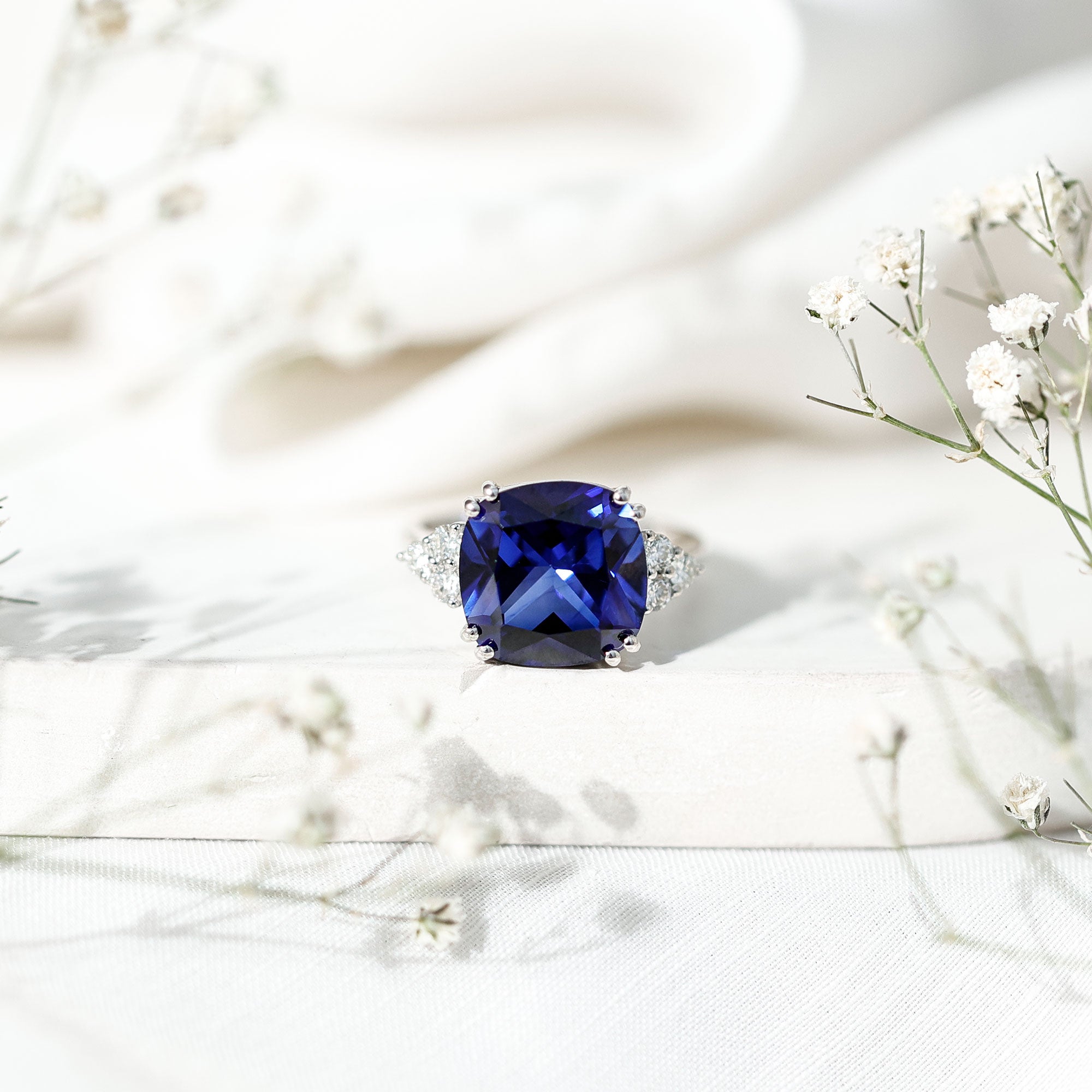Certified 9 Carat Lab Grown Blue Sapphire Cushion Cut Engagement Ring with Diamond Trio AAAA - Rosec Jewels