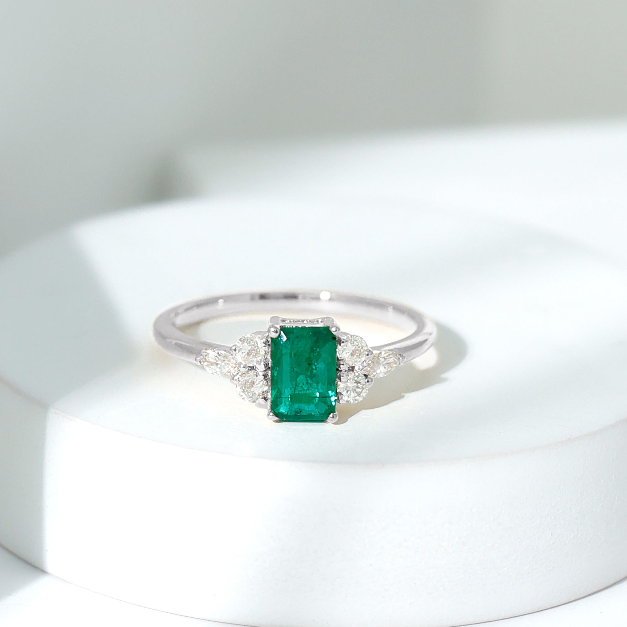 Rosec Jewels-Emerald Cut Emerald Engagement Ring with Diamond Trio