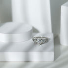 Rosec Jewels-1.5 Carat Heart Moissanite 3 Stone Engagement Ring in Crossover Band