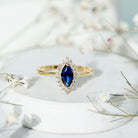Rosec Jewels-Marquise Cut Lab Grown Blue Sapphire and Diamond Halo Engagement Ring