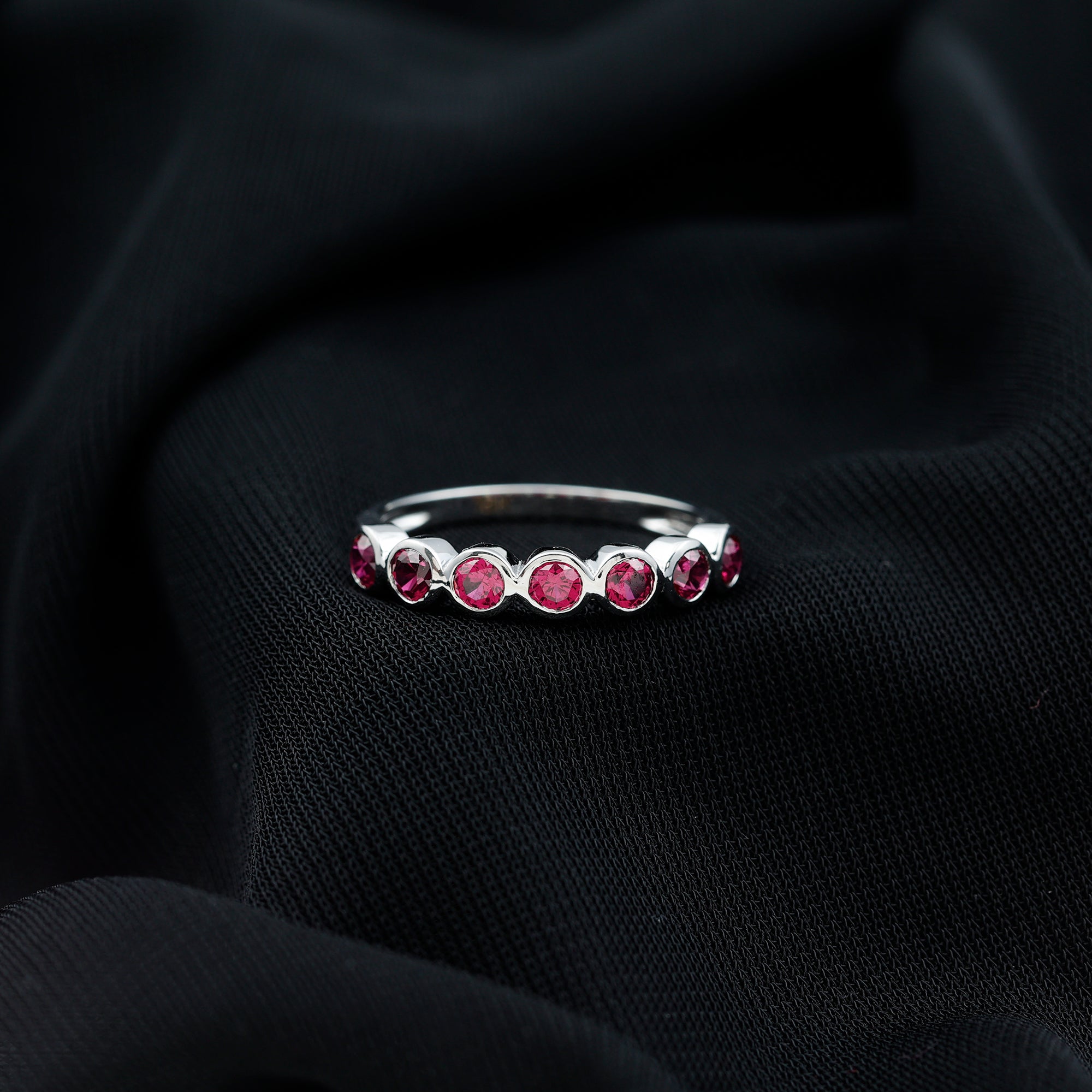Rosec Jewels-Minimal Created Ruby Half Eternity Ring in Bezel Setting