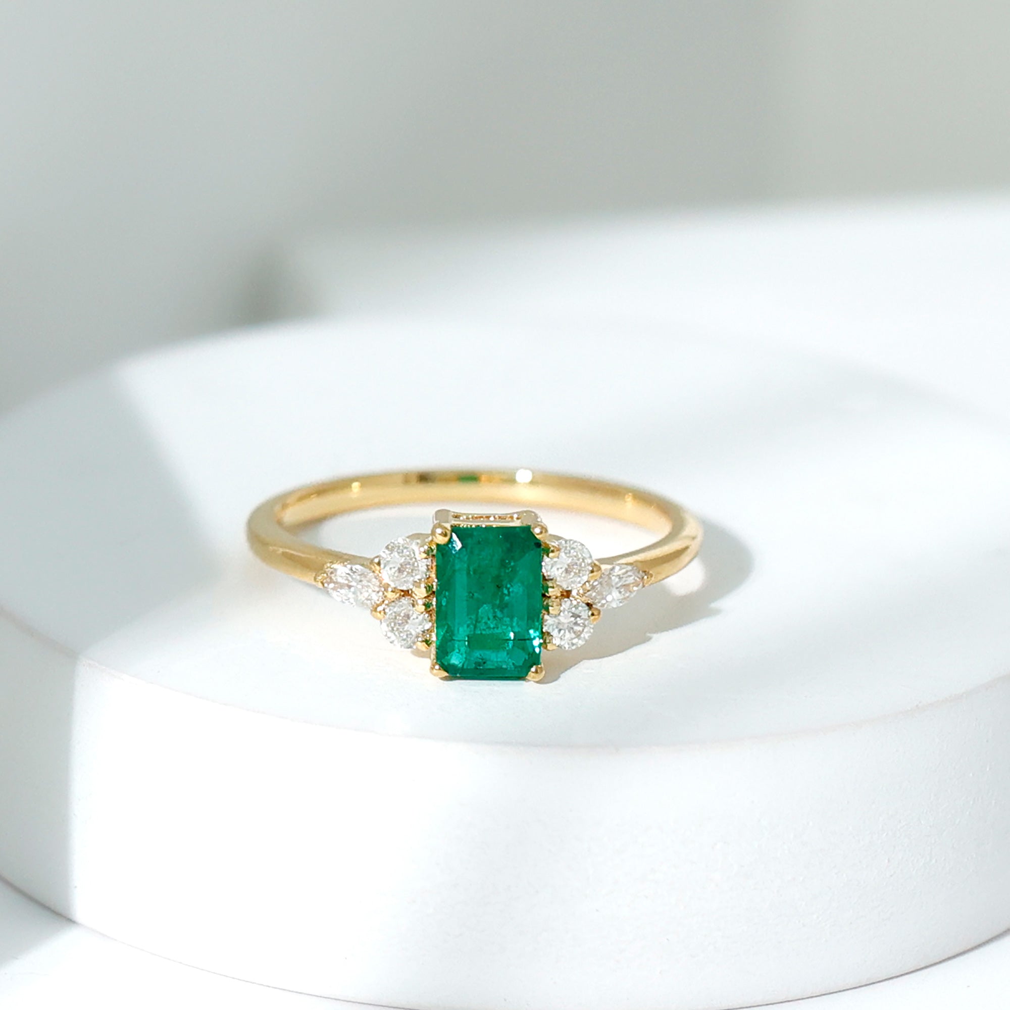 Rosec Jewels-Emerald Cut Emerald Engagement Ring with Diamond Trio