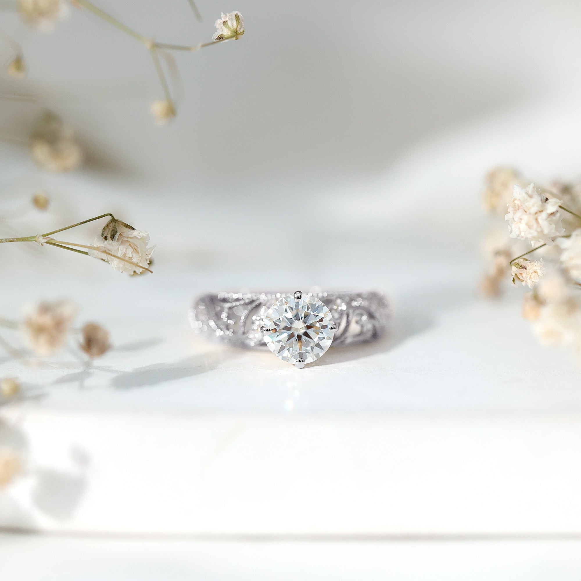 Rosec Jewels-Round Cut Moissanite Vintage Engagement Ring With Diagonal Prongs